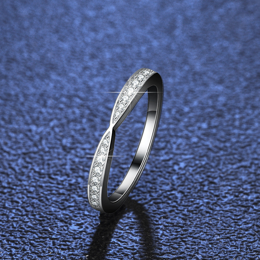 Elegant lady's moissanite engagement ring featuring a sleek design with sparkling accents