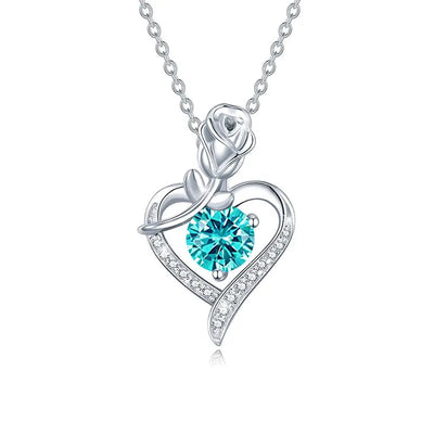 Beautiful sterling silver moissanite pendant with a rose design and teal gemstone for elegant jewelry lovers