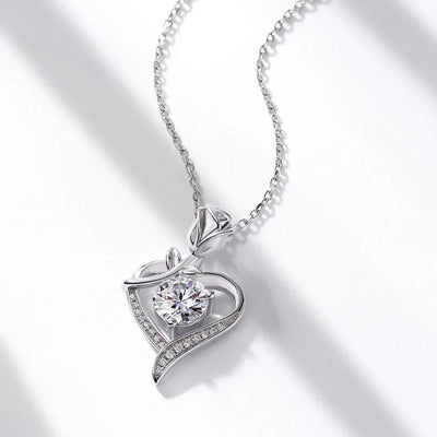 Elegant sterling silver moissanite pendant in a heart design with intricate detailing