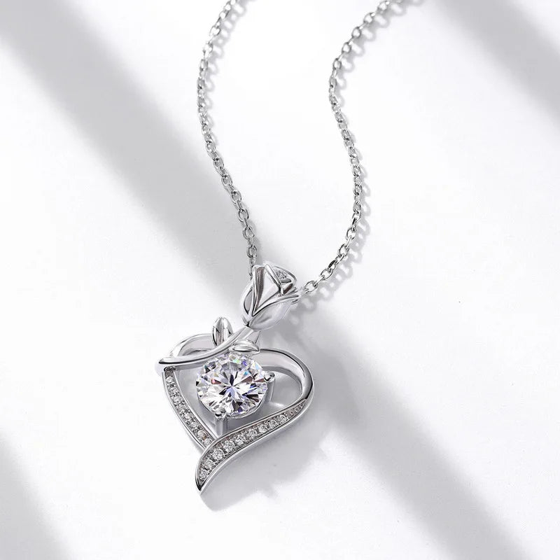 Elegant sterling silver moissanite pendant in heart design with sparkling details and a delicate chain