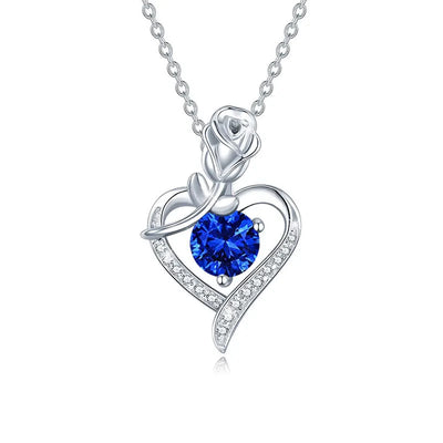 Elegant sterling silver moissanite pendant with blue gemstone and rose design for a stunning look