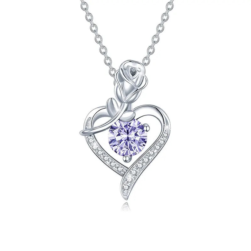 Sterling silver moissanite pendant featuring a heart design with a rose and sparkling stones